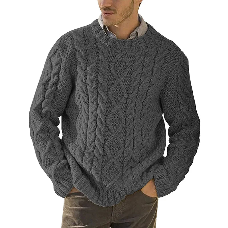 Man wearing the charcoal grey Highland cable-knit crewneck sweater
