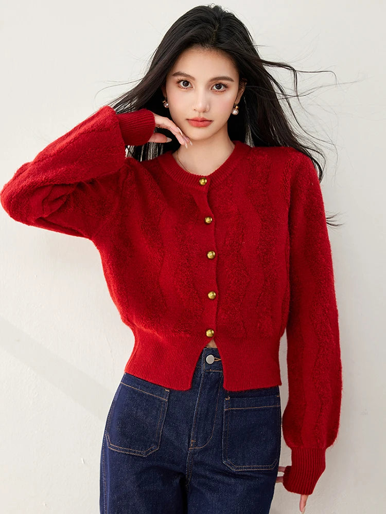 Woman wearing the beige cable-knit button-front cardigan