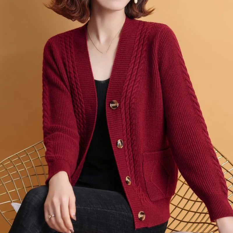 Woman wearing the burgundy cable-knit button-front cardigan