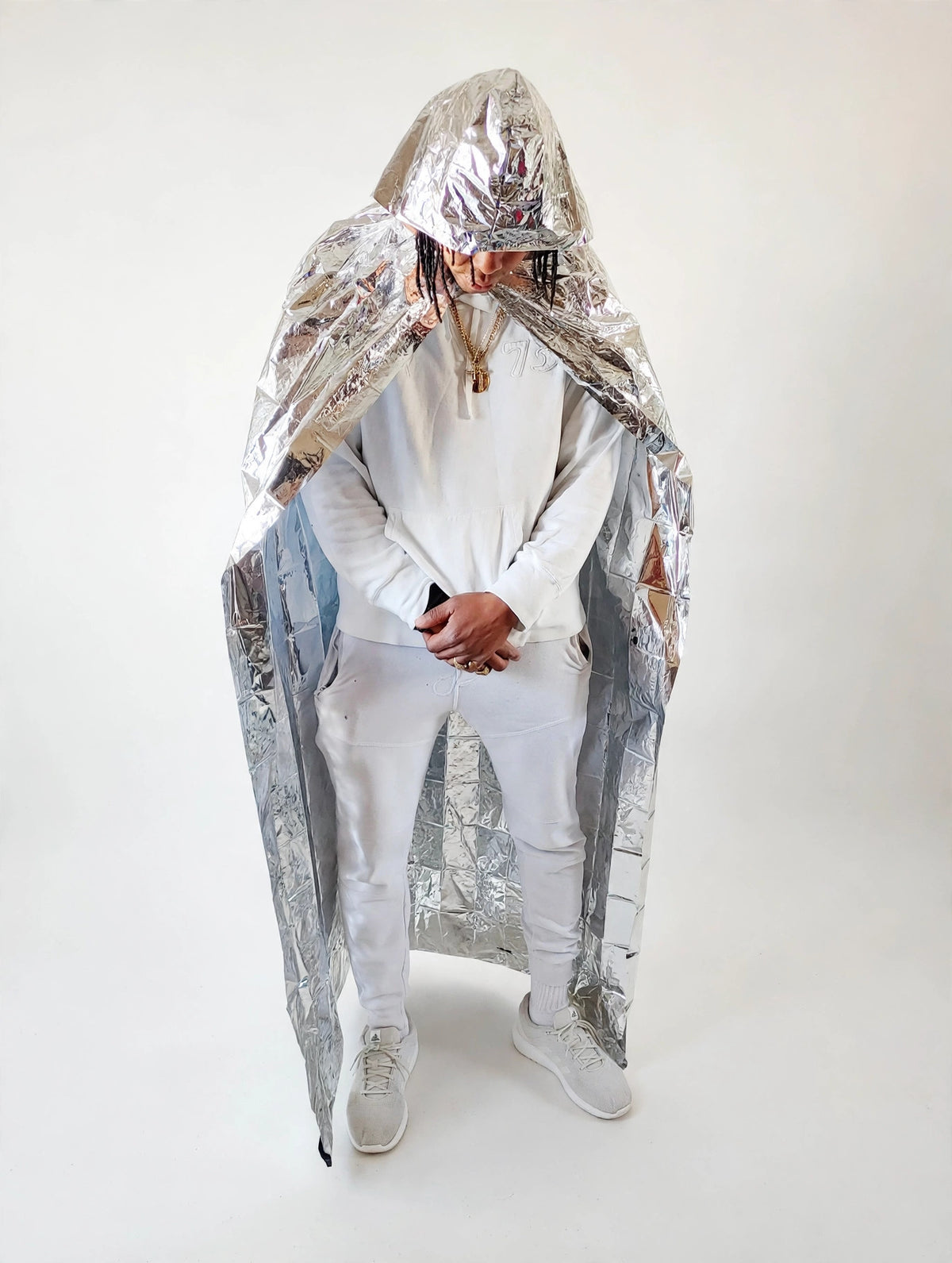 McGregor Clan Mylar Thermal Hooded Cloak worn — full-length silver thermal cloak with hood. Manufactured by McGregor Clan Inventions Inc.
