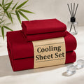 Four-piece deep pocket sheet set with fitted sheet, flat sheet and pillowcases on a bed